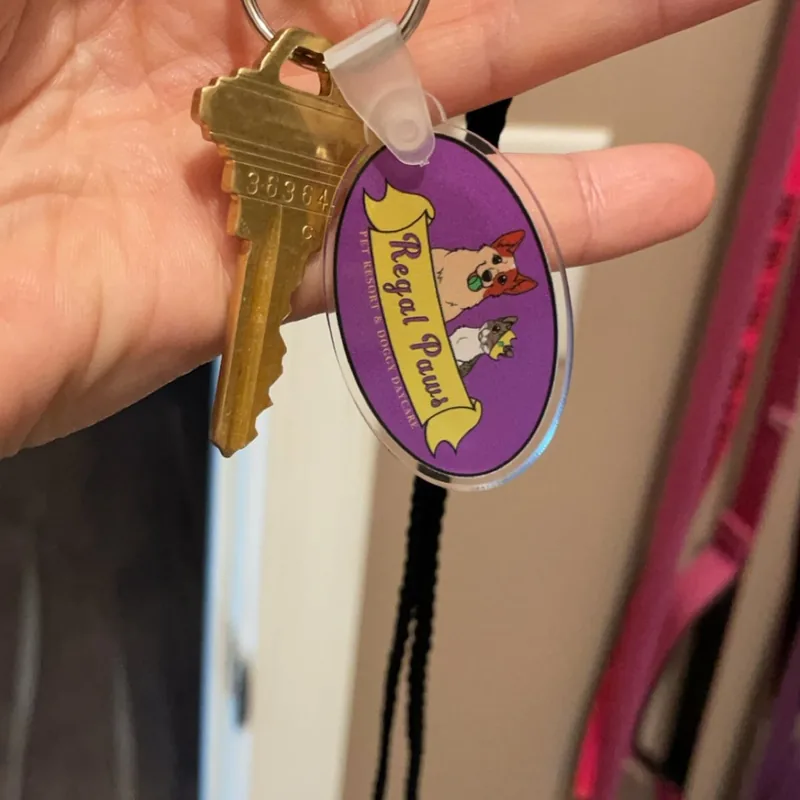 Regal Paws small business logo keychain on real keyring